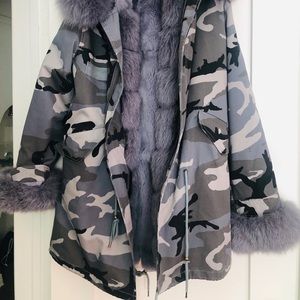 zippered in fox fur lining and fur hood and cuffs